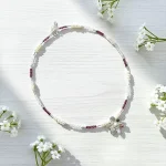 Collar artesanal de plata con granate y cuarzo cristal