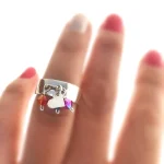 Anillo Cascavel artesanal en plata con corazón colgante