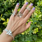 Anillos y pulsera flores de plata