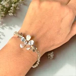 Pulsera rolo de plata con flores