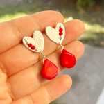 Aros exclusivos con coral natural y diseño en plata