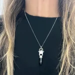 Joya artesanal de plata con estrella y piedra ónix protectora