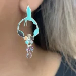 Aros exclusivos de plata con colibrí y hojas detalladas