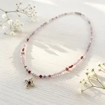 Collar nudo de bruja con amatista y granate hecho a mano