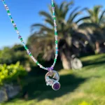 Joya artesanal de colibrí y flor con amatista