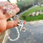 Collar plata luna jardín con colibrí y detalles florales