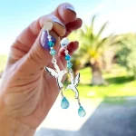 Aros colibrí de plata 950 con calcedonia celeste