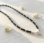Collar de protección con turmalina negra y broche timón