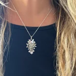 colgante pirita corazón con mariposa en plata 950