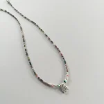 Joya artesanal con elefante de plata y piedras de turmalina