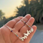 collar columpio mariposa hecho a mano
