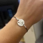 pulsera hilo rojo signo plata