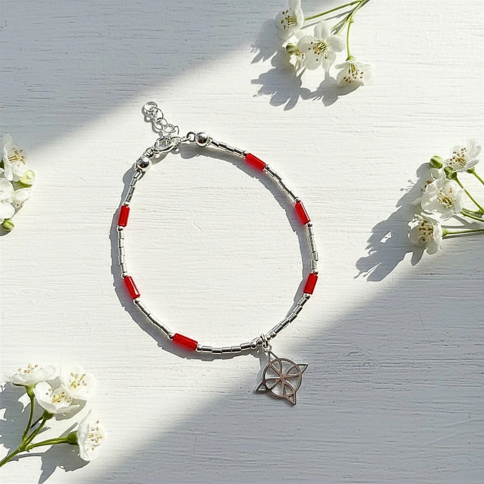 Pulsera nudo mostacillas con coral natural y plata