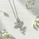 Colgante colibrí hibiscus en plata 950 con cuarzo cristal