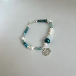 Pulsera espiritual con apatita y aguamarina, perlas cultivadas y terminación plata 950 - colección Divinity