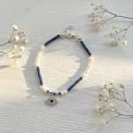 pulsera ojo azul lapislazuli perlas naturales plata hecha a mano