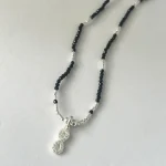 collar con simbolo infinito y turmalina negra proteccion energia