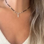 collar de protección con turmalina negra y simbolo infinito