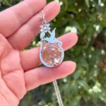 Colgante colibrí artesanal con esfera giratoria de cuarzo fumé natural y plata 950 - Pilar Segura Orfebre