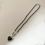 Collar de ónix naturales con colgante corazón calado en plata 950 - Pilar Segura Orfebre Chile