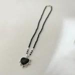 Collar artesanal único con colgante corazón de ónix negro y cadena de ónix naturales plata 950 Chile