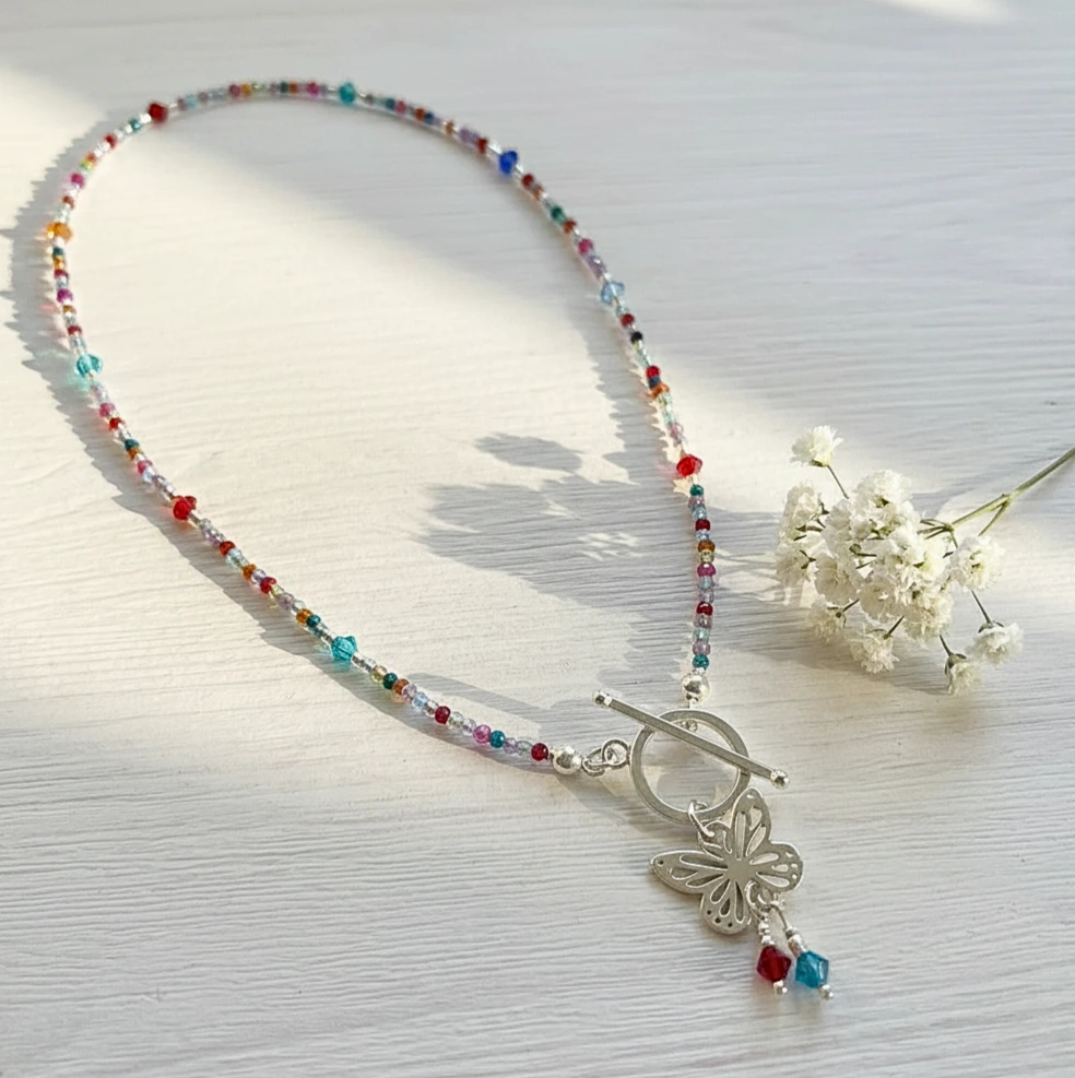 Collar con flor alas de ensueño