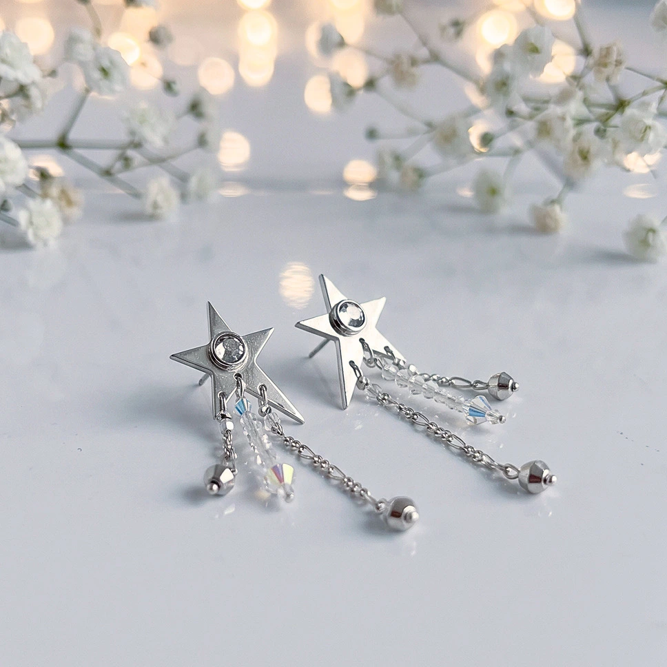 Aros Lluvia Estelar con estrella artesanal plata 950 y cristales Swarovski certificados Chile Pilar Segura