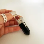 Colgante talismán con punta de ónix, piedra luna 3A y Swarovski, lunas estrellas plata 950 artesanal Chile